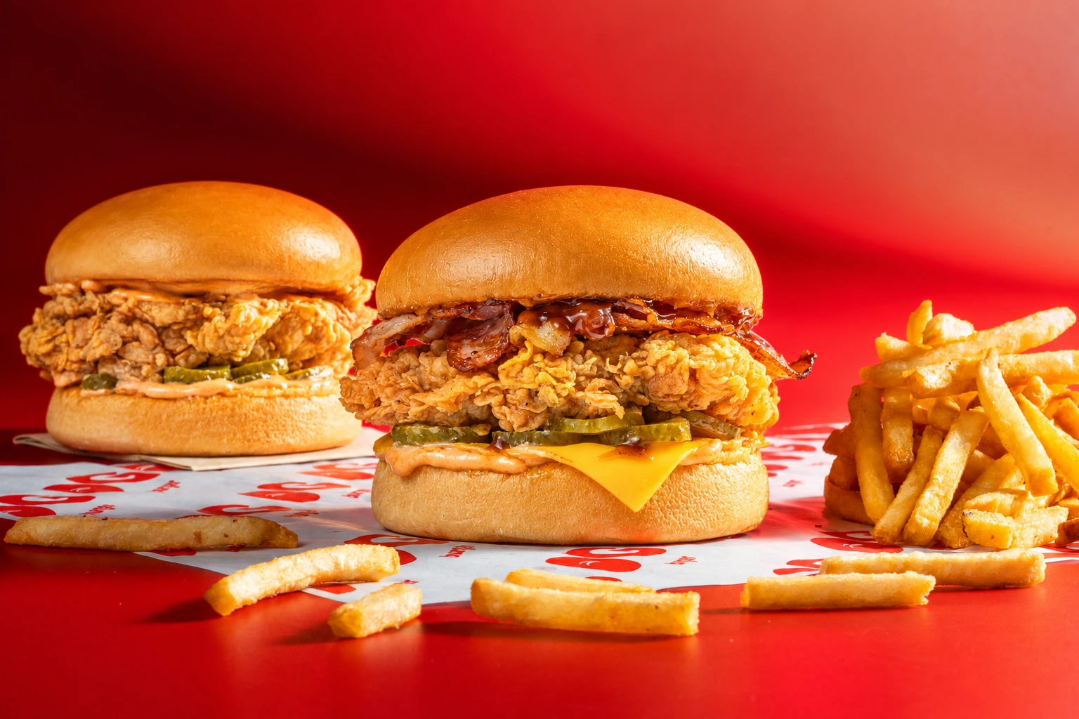 OGChicken Burger and OGChicken Deluxe Burger with golden fries
